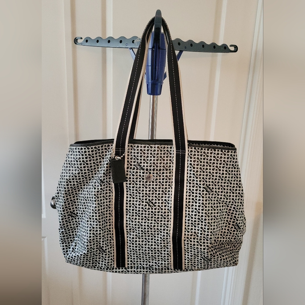 Coach Penelope Op Art Signature PVC Weekender Carry-On Tote in black and white.